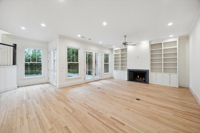 3707 Jardin St, Houston, TX 77005 - unfurnished living room featuring ceiling fan, light wood-type flooring, a warm lit fireplace, baseboards, and ornamental molding