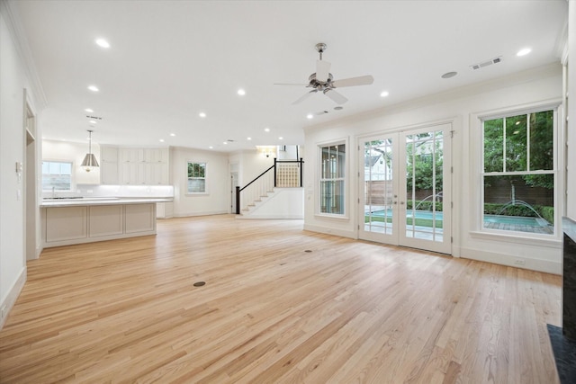3707 Jardin St, Houston, TX 77005 - unfurnished living room with ornamental molding, stairs, plenty of natural light, light wood finished floors, and recessed lighting