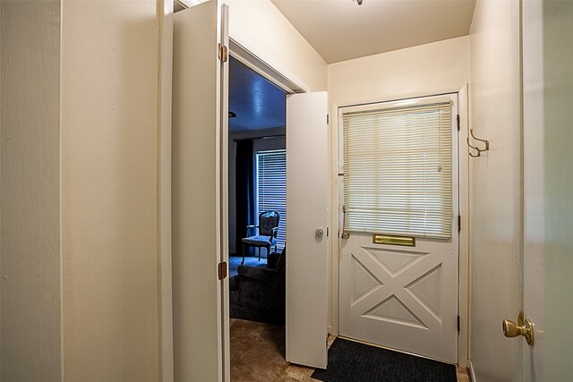9385 Shepherd Dr, Beaumont, TX 77707 - doorway to outside featuring carpet floors