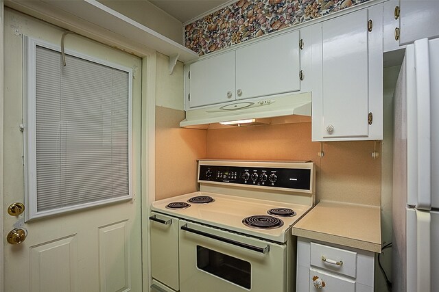 9385 Shepherd Dr, Beaumont, TX 77707 - kitchen featuring white appliances, under cabinet range hood, and light countertops