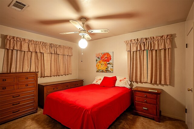 9385 Shepherd Dr, Beaumont, TX 77707 - bedroom with dark colored carpet and a ceiling fan