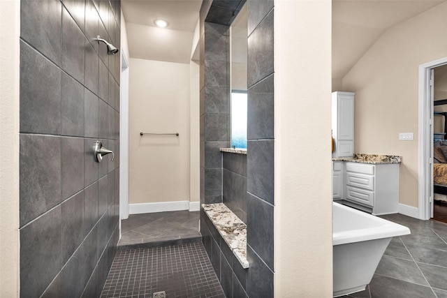 15527 Salmon Springs Dr, Conroe, TX 77302 - full bathroom featuring tile patterned floors, a tile shower, vanity, baseboards, and recessed lighting