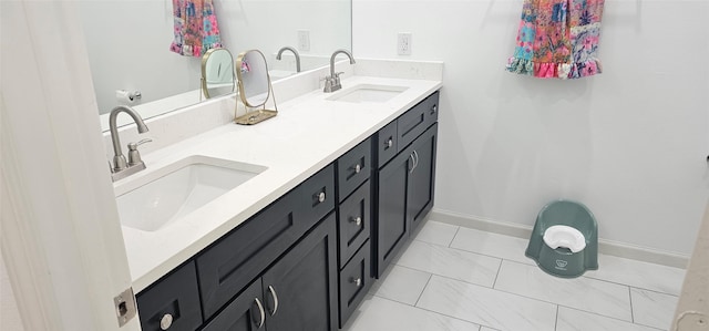 11378 Underwood St, Willis, TX 77318 - bathroom featuring double vanity, baseboards, and marble look tiles