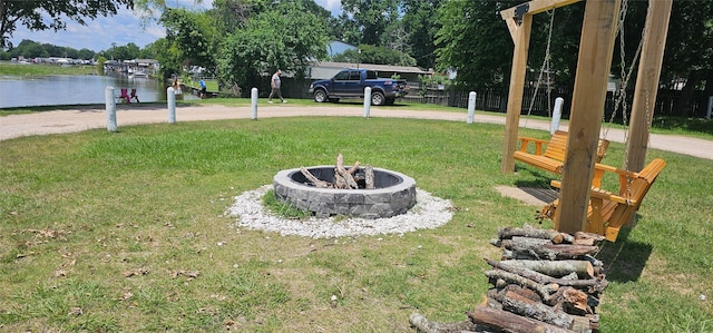 11378 Underwood St, Willis, TX 77318 - view of grassy yard featuring an outdoor fire pit