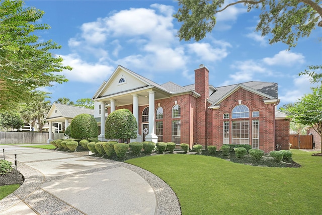 16506 Emilia Ct, Spring, TX 77379 - view of front of house featuring brick siding, a chimney, covered porch, and a shingled roof