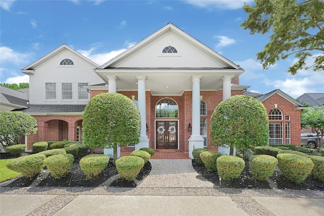 16506 Emilia Ct, Spring, TX 77379 - view of front of property featuring brick siding, a porch, and stucco siding