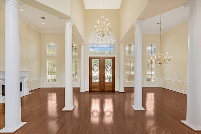 16506 Emilia Ct, Spring, TX 77379 - entryway featuring a high ceiling, a chandelier, a decorative wall, french doors, and a wainscoted wall