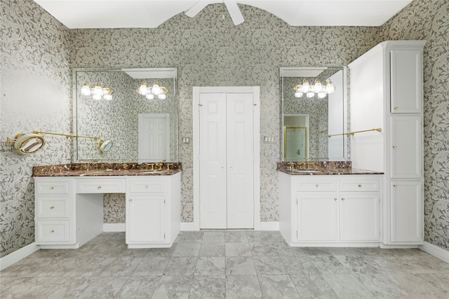 16506 Emilia Ct, Spring, TX 77379 - bathroom featuring wallpapered walls, a closet, two vanities, a ceiling fan, and a chandelier