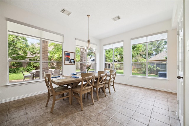 7327 Crescent Bridge Ct, Humble, TX 77396 - tiled dining space with healthy amount of natural light and baseboards