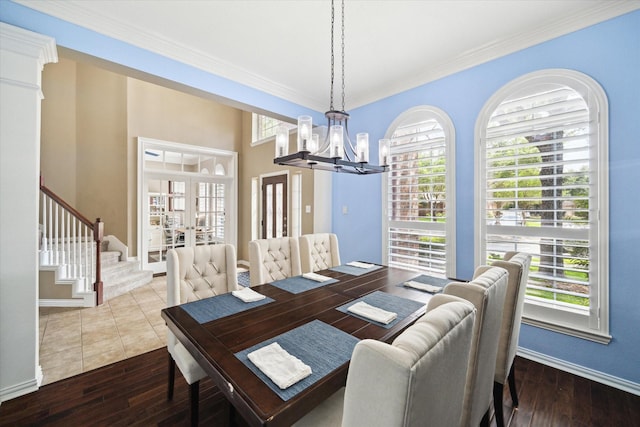 7327 Crescent Bridge Ct, Humble, TX 77396 - dining area with french doors, a chandelier, healthy amount of natural light, hardwood / wood-style flooring, and ornamental molding
