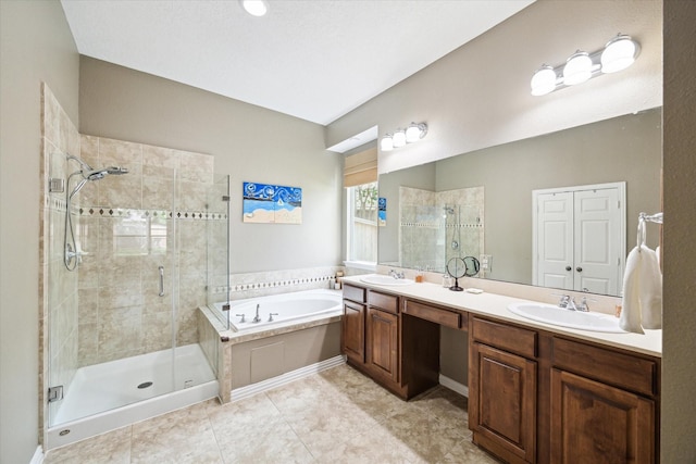 7327 Crescent Bridge Ct, Humble, TX 77396 - bathroom with a garden tub, a shower stall, double vanity, and tile patterned floors