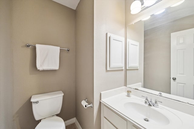7327 Crescent Bridge Ct, Humble, TX 77396 - bathroom with toilet, vanity, and baseboards