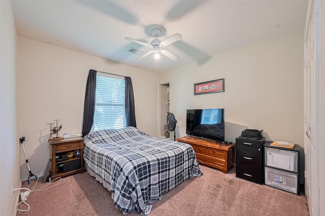 109 Moonspinner, Conroe, TX 77356 - carpeted bedroom with a ceiling fan and a textured ceiling