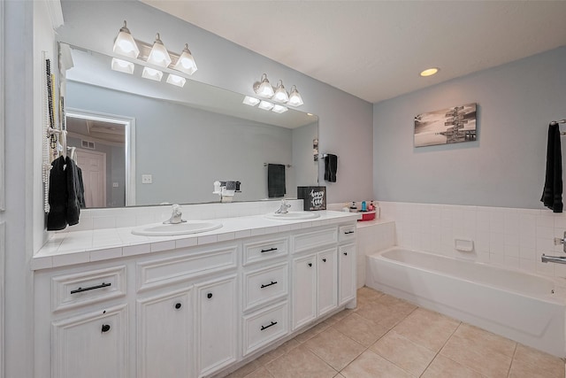 109 Moonspinner, Conroe, TX 77356 - bathroom with tile patterned flooring, double vanity, a garden tub, and recessed lighting