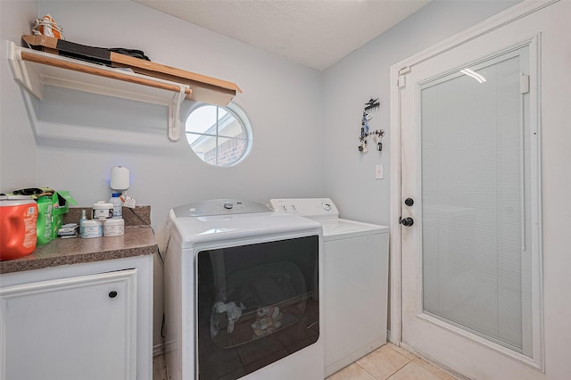109 Moonspinner, Conroe, TX 77356 - washroom with washer and dryer and light tile patterned floors