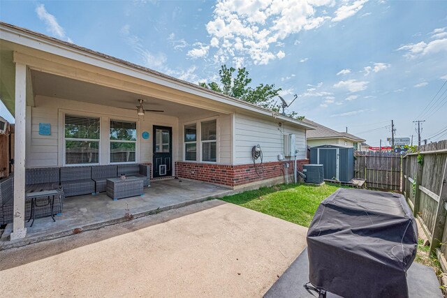 109 Moonspinner, Conroe, TX 77356 - fenced backyard with a patio area, ceiling fan, an outdoor living space, and cooling unit