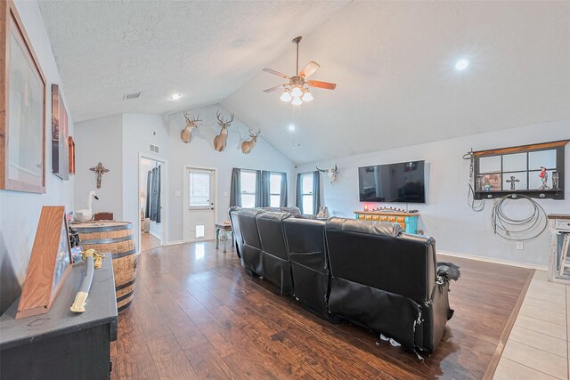 109 Moonspinner, Conroe, TX 77356 - living area featuring a ceiling fan, lofted ceiling, wood finished floors, baseboards, and recessed lighting