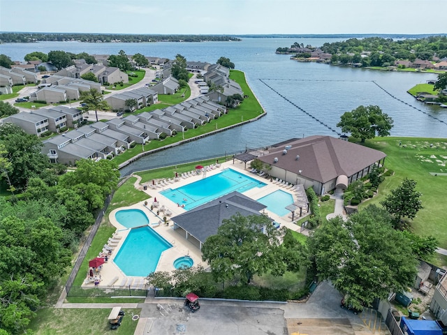 109 Moonspinner, Conroe, TX 77356 - drone / aerial view of a pool area and a nearby body of water