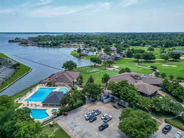 109 Moonspinner, Conroe, TX 77356 - bird's eye view of a large body of water, a pool, and a local golf course