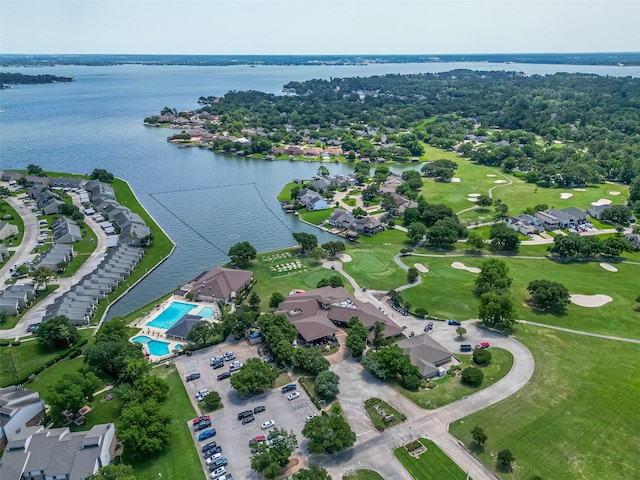 109 Moonspinner, Conroe, TX 77356 - aerial view of property's location featuring a large body of water, nearby suburban area, and a pool area