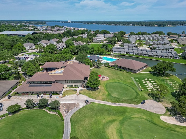 109 Moonspinner, Conroe, TX 77356 - aerial view of property and surrounding area with a large body of water, a golf course, and nearby suburban area