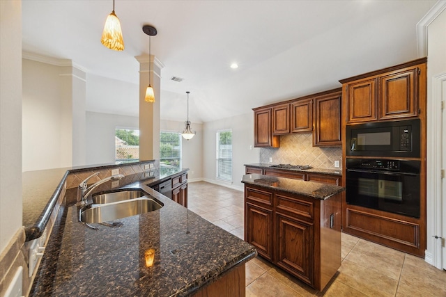 1044 Cayman Bend Ln, League City, TX 77573 - kitchen with black appliances, a sink, tasteful backsplash, light tile patterned floors, and decorative light fixtures