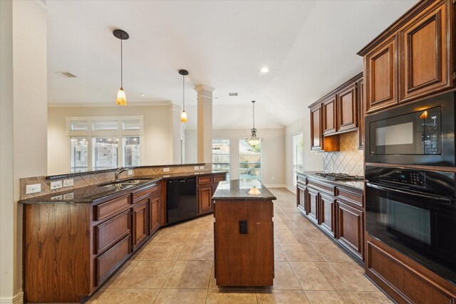 1044 Cayman Bend Ln, League City, TX 77573 - kitchen featuring black appliances, a sink, a kitchen island, decorative backsplash, and dark stone countertops