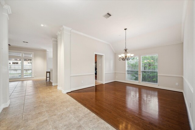 1044 Cayman Bend Ln, League City, TX 77573 - empty room with crown molding, a chandelier, tile patterned flooring, and baseboards