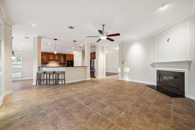 1044 Cayman Bend Ln, League City, TX 77573 - living area featuring a ceiling fan, crown molding, a tile fireplace, recessed lighting, and tile patterned flooring