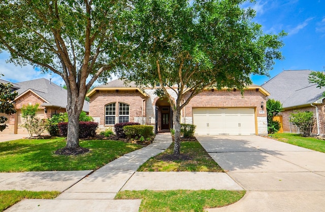 4926 Erin Ashley Ln, Katy, TX 77494 - traditional home with brick siding, driveway, an attached garage, and a front lawn