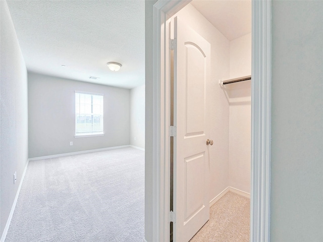spacious closet featuring carpet