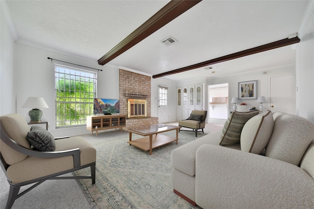 4822 Droddy St, Houston, TX 77091 - living room with beam ceiling, plenty of natural light, a brick fireplace, and ornamental molding
