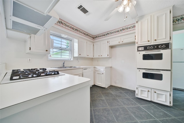 4822 Droddy St, Houston, TX 77091 - kitchen featuring white appliances, under cabinet range hood, and white cabinets