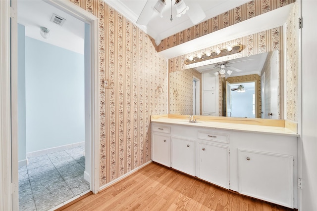 4822 Droddy St, Houston, TX 77091 - bathroom with a ceiling fan, wallpapered walls, wood finished floors, ornamental molding, and baseboards