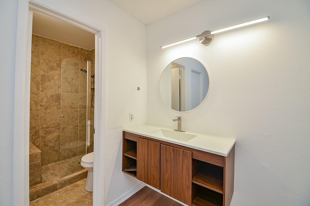 3538 Ocee St, Houston, TX 77063 - full bathroom with a tile shower, toilet, and vanity