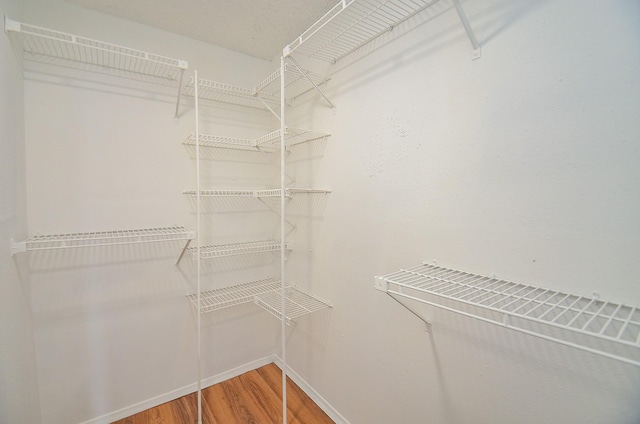 3538 Ocee St, Houston, TX 77063 - walk in closet featuring wood finished floors