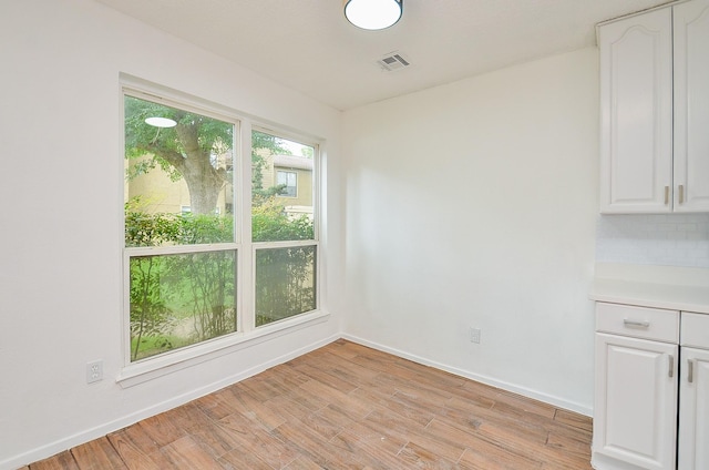 3538 Ocee St, Houston, TX 77063 - unfurnished dining area with baseboards and light wood finished floors