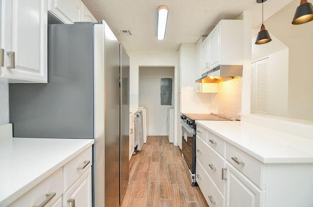 3538 Ocee St, Houston, TX 77063 - kitchen with appliances with stainless steel finishes, under cabinet range hood, electric panel, light wood-style floors, and white cabinets