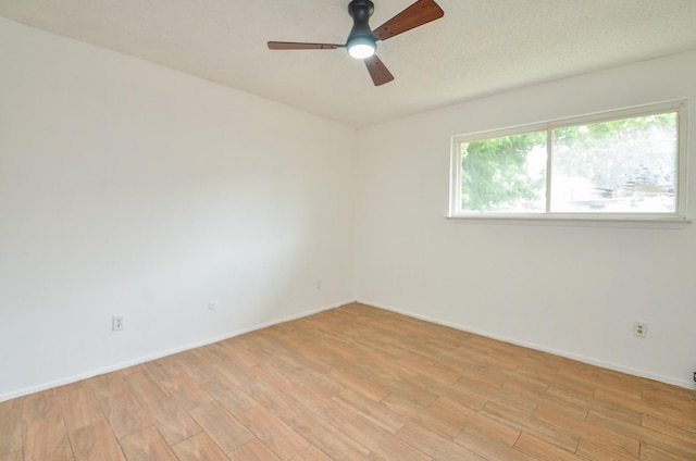 3538 Ocee St, Houston, TX 77063 - spare room with light wood-style flooring, a ceiling fan, and baseboards
