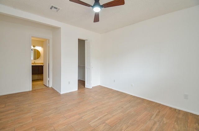 3538 Ocee St, Houston, TX 77063 - unfurnished bedroom featuring light wood-style floors, a closet, baseboards, and ensuite bath