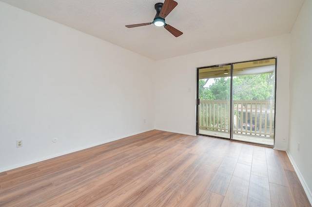 3538 Ocee St, Houston, TX 77063 - empty room featuring light wood-type flooring, a ceiling fan, baseboards, and a textured ceiling