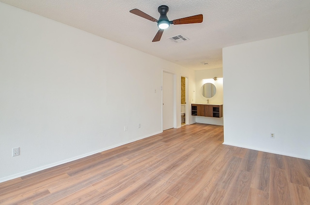 3538 Ocee St, Houston, TX 77063 - spare room featuring light wood-style floors, a ceiling fan, and baseboards