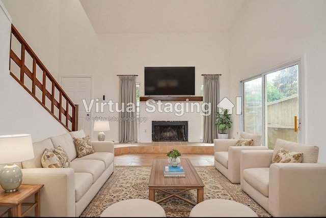 3538 Ocee St, Houston, TX 77063 - living room featuring a towering ceiling, stairs, and a fireplace