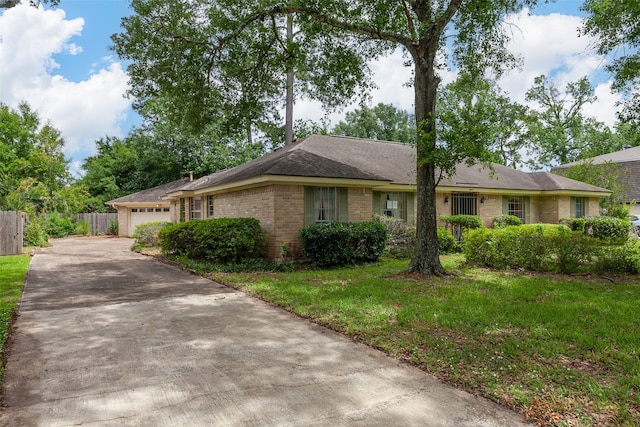 2812 Fairway Dr, Orange, TX 77630 - ranch-style home featuring brick siding, driveway, a garage, and a shingled roof