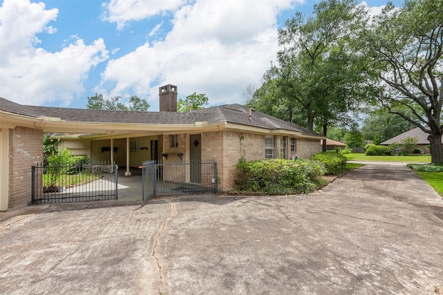 2812 Fairway Dr, Orange, TX 77630 - view of front of property with brick siding, a chimney, fence, and a gate