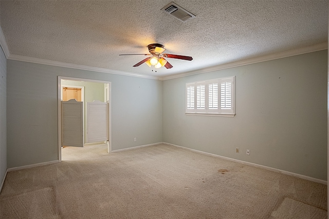 2812 Fairway Dr, Orange, TX 77630 - spare room with crown molding, a ceiling fan, light colored carpet, baseboards, and a textured ceiling