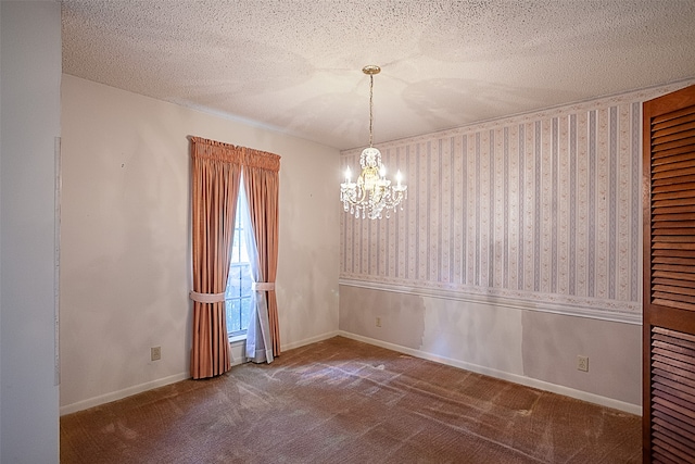 2812 Fairway Dr, Orange, TX 77630 - carpeted empty room with a chandelier, a textured ceiling, and baseboards