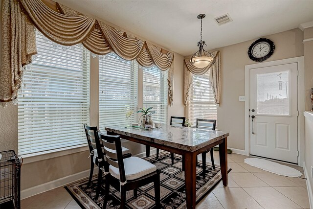 3619 Canton Hills Ln, Missouri City, TX 77459 - dining room with light tile patterned floors and baseboards