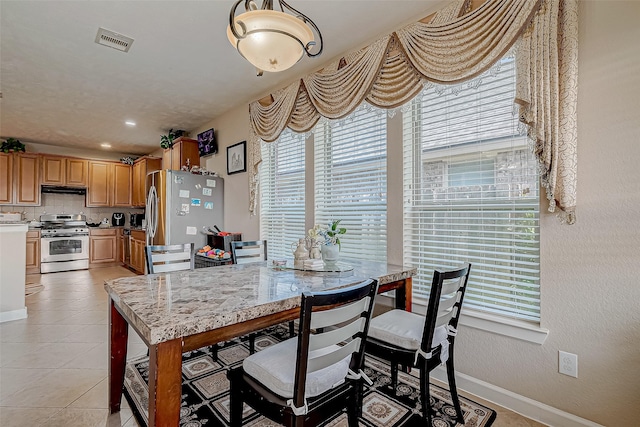 3619 Canton Hills Ln, Missouri City, TX 77459 - dining area featuring plenty of natural light, baseboards, and light tile patterned floors