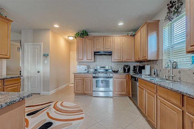 3619 Canton Hills Ln, Missouri City, TX 77459 - kitchen with appliances with stainless steel finishes, under cabinet range hood, a sink, backsplash, and light tile patterned flooring